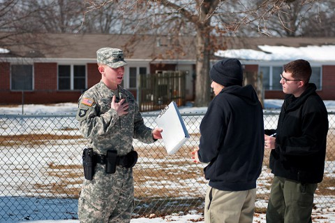 Spc. Brian Coates, a military police officer assigned to the 218th Military Police Company, 716th Military Police Battalion, supported by the 101st Sustainment Brigade, 101st Airborne Division, questions Spc. Trenton Taitague, a member of the Fort Campbell Special Reaction Team portraying a domestic abuse perpetrator, during a domestic violence training scenario Feb. 26 at Fort Campbell.  (Sgt. Leejay Lockhart, 101st Sustainment Brigade Public Affairs)