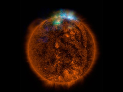 X-rays stream off the sun in this image showing observations from by NASA's Nuclear Spectroscopic Telescope Array, or NuSTAR, overlaid on a picture taken by NASA's Solar Dynamics Observatory (SDO)