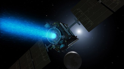 This artist's concept shows NASA's Dawn spacecraft arriving at the dwarf planet Ceres (lower right). (NASA/JPL-Caltech)