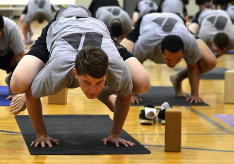 Soldiers with the 2nd Brigade Combat Team, 101st Airborne Division, conduct yoga during one of the weekly classes offered by Joined Forces Yoga. Joined Forces Yoga is a nonprofit organization that provides free yoga classes to service members, veterans, family members and Department of Defense civilians. (U.S. Army photo by Sgt. Sierra A. Fown, 2nd Brigade Combat Team, 101st Airborne Division (Air Assault) Public Affairs)