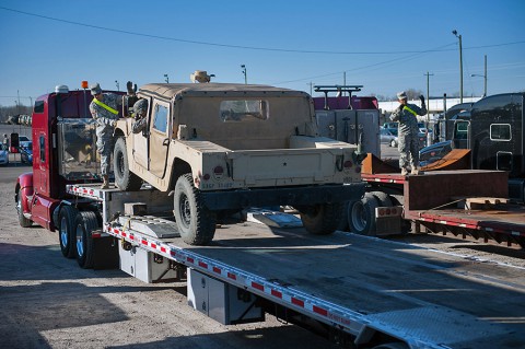 Maj. Cristoffer Honan (left), assistant supply and services chief 101st Airborne Division, helps ground guide a Humvee March 30 at Fort Campbell, KY. (Sgt. Leejay Lockhart, 101st Sustainment Brigade Public Affairs)