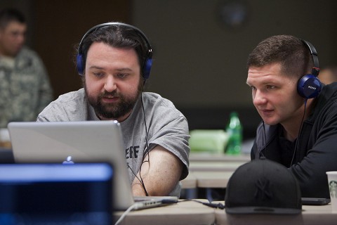 I Was There film workshop mentor Sean Mannion, left, advises filmmaker Spc. James Bomar II, 1st Brigade Combat Team, 101st Airborne Division, during the final edits of a collaborative film project. (David E. Gillespie)