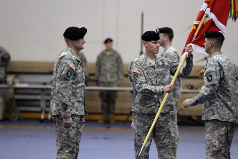 Lt. Col. Christopher D. Payant, center, commander of the 39th Brigade Engineer Battalion, 2nd Brigade Combat Team, 101st Airborne Division, passes the unit colors to Command Sgt. Maj. Vincent Silva, the senior noncommissioned officer of the 39th BEB, during an activation ceremony for the aforementioned battalion April 16, 2015, at Freedom Fighters Physical Fitness Center here. (Sgt. David Cox, 2BCT PAO)