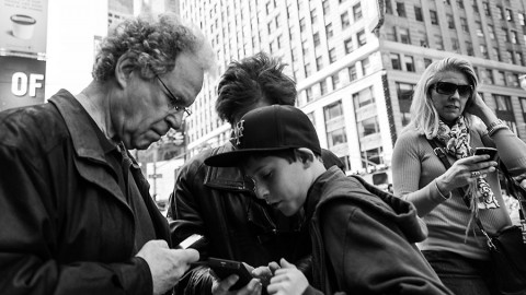 Cell phones can detect ground motion and warn others before strong shaking arrives. ("Everyone Check Your Phones - NYC" by Jim Pennucci, used under CC BY.)