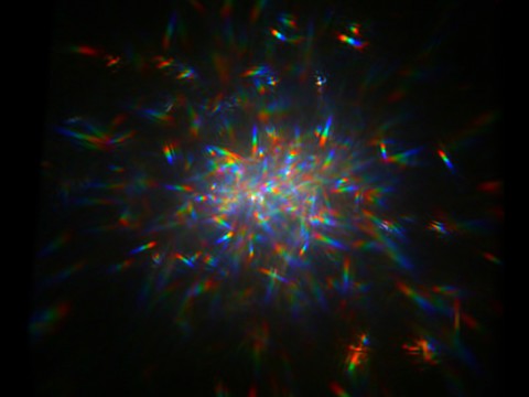 This image shows white light reflected off of a glitter mirror onto a camera sensor. Researchers tested this in a laboratory as part of the concept of "Orbiting Rainbows," a low-cost solution for space telescope mirrors. (G. Swartzlander/Rochester Institute of Technology) This image shows white light reflected off of a glitter mirror onto a camera sensor. Researchers tested this in a laboratory as part of the concept of "Orbiting Rainbows," a low-cost solution for space telescope mirrors. (G. Swartzlander/Rochester Institute of Technology)