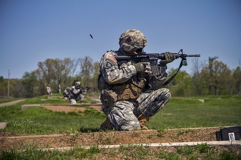 Sgt. Nathan Joachim, Company D, 1st Brigade Combat Team, 101st Airborne Division (Air Assault), fires his M4 rifle while in the kneeling unsupported firing position on a range here during the division’s 2015 Soldier and noncommissioned officer of the year April 23, 2015. Joachim, is a native of Katy, Texas. (Staff Sgt. Terrance D. Rhodes, 101st Airborne Division (Air Assault) Public Affairs)