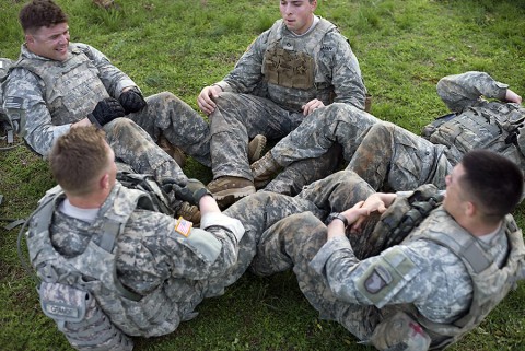 During the best squad physical fitness competition, Soldiers in Company D, 1st Battalion, 327th Infantry Regiment, 1st Brigade Combat Team, 101st Airborne Division (Air Assault), linked together to complete their mandatory 300 situps April 10. Each squad had to complete a two and a half mile course with challenges such as transporting a casualty, reacting to contact and weapons assembly. (Sgt. Samantha Parks, 1st Brigade Combat Team)