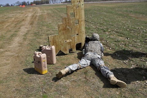 A Soldier in Company D “Maddogs,” 1st Battalion, 327th Infantry Regiment, 1st Brigade Combat Team, 101st Airborne Division (Air Assault), shoots at a 200 meter target during the best shooter competition April 9. Soldiers had to maneuver around barriers when shooting, then transport various challenges to the next barrier. (Sgt. Samantha Parks, 1st Brigade Combat Team)