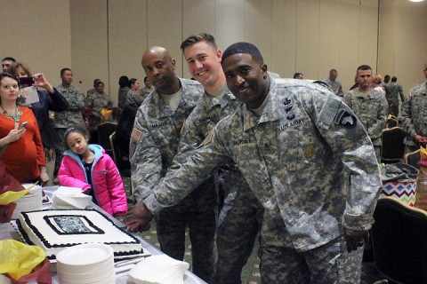 During the 426th Brigade Support Battalion, 1st Brigade Combat Team, 101st Airborne Division noncommissioned officer induction ceremony at Cole Park Commons March 27, Command Sgt. Maj. Rodney Macon, command sergeant major for 426th BSB, Sgt. Philip Thomas, an NCO inductee in 426th BSB, and Command Sgt. Maj. Joe Burney Jr., the ceremony’s guest speaker, cut the ceremony cake for friends and family to enjoy. (2nd Lt. Sarah Hutchison, 426th BSB Unit Public Affairs Team)