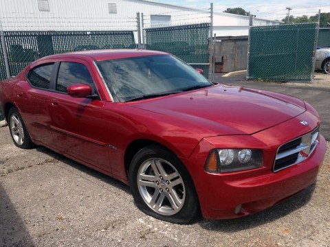 Red Dodge Charger used to evade police.