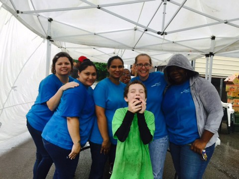 It may have been raining, but that didn’t stop the team from coming out and volunteering. They loaded up and headed to downtown Clarksville where they spent the day passing out food.