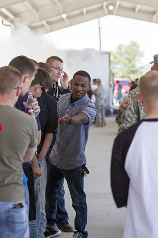 Sgt. Tireh Sanders, a military policeman with the 561st Military Police Company, 716th Military Police Battalion, supported by the 101st Sustainment Brigade, 101st Airborne Division, helps guide others during a team building game May 1, 2015, at Fort Campbell, Ky. Movement rules presented challenges that participants could only solve by cooperating and helping each other. (Sgt. Leejay Lockhart, 101st Sustainment Brigade, 101st Airborne Division (Air Assault) Public Affairs)