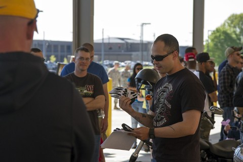 Sgt. David Camacho, a military policeman with Headquarters and Headquarters Detachment, 716th Military Police Battalion, supported by the 101st Sustainment Brigade, 101st Airborne Division, demonstrates examples of proper personal protective equipment for motorcyclists during a battalion safety training event May 1, 2015, at Fort Campbell, Ky. Motorcycle safety was one of the many topics covered in the event, which sought to prevent accidents and maintain readiness. (Sgt. Leejay Lockhart, 101st Sustainment Brigade, 101st Airborne Division (Air Assault) Public Affairs)