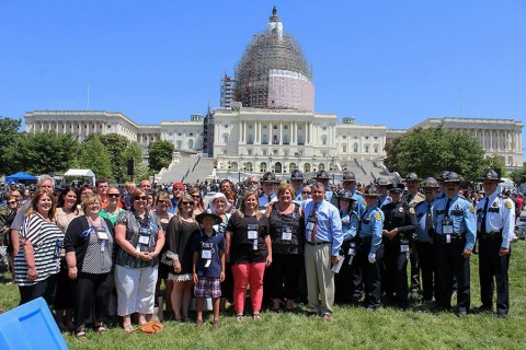 Montgomery County Sheriff officers and the Johnson family pose in front of the capitol. (MCSO)