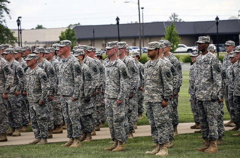 Soldiers from the Wisconsin and Utah Army National Guard and U.S. Army Reserve sing the Army song after donning the historic "Old Abe" patch ceremony at 101st Division Headquarters, at Fort Campbell, Ky., June 16, 2015. (Staff Sgt. Terrance D. Rhodes, 2nd Brigade Combat Team, 101st Airborne Division (AA) Public Affairs)