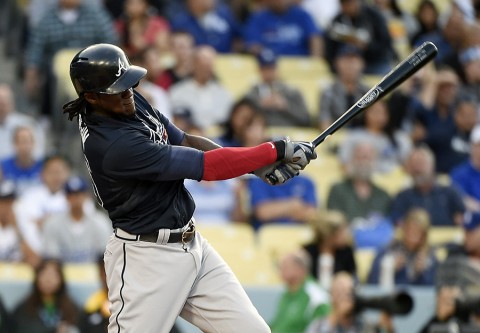 Atlanta Braves center fielder Cameron Maybin (25) singles against the Los Angeles Dodgers during the first inning of the game at Dodger Stadium. (Richard Mackson-USA   TODAY Sports)