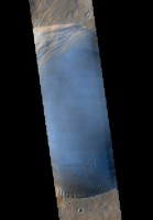 Seen shortly after local Martian sunrise, clouds gather in the summit pit, or caldera, of Pavonis Mons, a giant volcano on Mars, in this image from the Thermal Emission Imaging System (THEMIS) on NASA’s Mars Odyssey orbiter. (NASA/JPL-Caltech/Arizona State University)