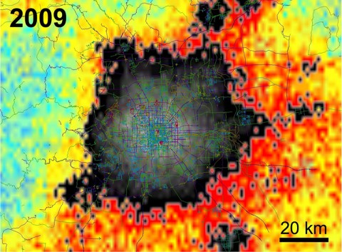 Data from NASA's QuikScat satellite show the changing extent of Beijing between 2000 and 2009 through changes to its infrastructure. Gray and black indicate buildings, with the tallest and largest buildings in the city's commercial core appearing lighter gray. Other colors show changes in areas not yet urbanized (for example, clearing land or cutting down trees), with the rate of change indicated by color. Blue-green indicates the least change, yellow-orange more change, and red the greatest change. (NASA/JPL-Caltech)