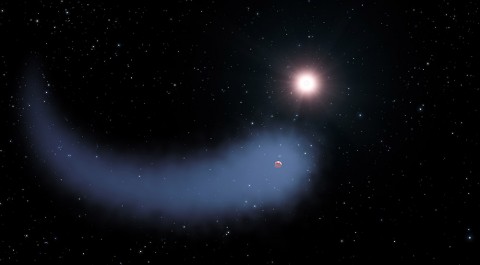 This artist's concept shows "The Behemoth," an enormous comet-like cloud of hydrogen bleeding off of a warm, Neptune-sized planet just 30 light-years from Earth. Also depicted is the parent star, which is a faint red dwarf named GJ 436. The hydrogen is evaporating from the planet due to extreme radiation from the star. A phenomenon this large has never before been seen around any exoplanet. (NASA, ESA, and G. Bacon (STScI))