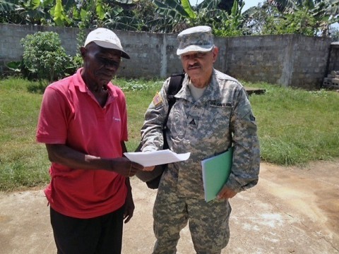 Angel Rivera, a Corps realty assistant, works with Liberian officials to hammer out leases and land-use agreements for Operation United Assistance, a humanitarian assistance mission aimed to combat the Ebola epidemic killing thousands of Liberians. Rivera deployed with eight Army civilian volunteers and four Soldiers comprising the North Atlantic Division’s Forward Engineering Support Team, or FEST. (Courtesy Photo)