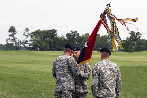 Maj. Gen. Gary J. Volesky, commanding general of the 101st Airborne Division passes the Strike colors to Col. Brett G. Sylvia during 2nd Brigade Combat Team’s change of command ceremony here, June 26, 2015. The passing of the guidon signifies Sylvia’s official assumption of command. (Staff Sgt. Terrance D. Rhodes, 2nd Brigade Combat Team, 101st Airborne Division (Air Assault) Public Affairs)