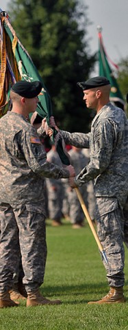 Brig. Gen. Darsie D. Rogers, the commanding general of 1st Special Forces Command (Airborne) (Provisional), passes the 5th Special Forces Group (Airborne) colors to Col. Kevin C. Leahy, 5th SFG (A) commander, during the 5th Special Forces Group (Airborne) change of command ceremony on Gabriel Field July 16, 2015. (Sgt. Jacob Mahaffey, 5th SFG(A) Public Affairs)