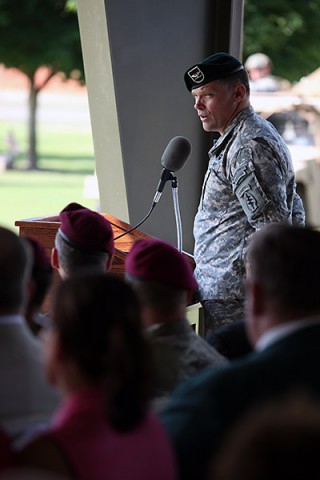 Col. John W. Brennan, outgoing commander of the 5th Special Forces Group (Airborne), speaks to Soldiers, family members and friends during the 5th SFG(A), change of command ceremony on Gabriel Field, July 16, 2015. (Sgt. Seth Plagenza, 5th SFG(A) Combat Camera)