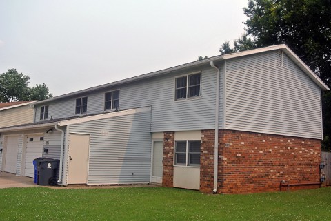 Pierce Village is bringing a new look to the neighborhood with new insulation, sheathing, siding, and installing new energy efficient windows and exterior doors. (Before photo)