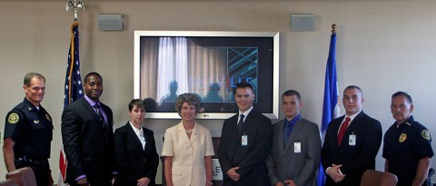 (Left to Right) Chief Ansley, Jarreil Peoples, Barbara Middleton, Mayor Kim McMillan, Gannon Gray, Matthew Johnson, Joseph Krzan, and Deputy Chief Gray.