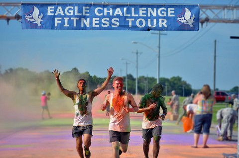 Spc. Ali Karim, Pvt. Andrew Neuman and Pvt. Christian Martinez, all Soldiers with 3rd Battalion, 187th Infantry Regiment, 3rd Brigade Combat Team, 101st Airborne Division (Air Assault), cross the finish line at the conclusion of the color run here July 18, 2015. The color run took place as part of the Eagle Challenge Fitness Tour. (Staff Sgt. Sierra Fown 2nd Brigade Combat Team, 101st Airborne Division (AA) Public Affairs)