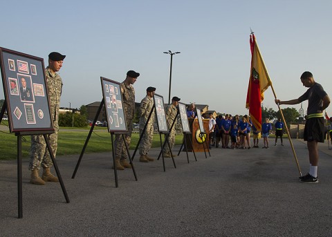 Members of the 101st Special Troops Battalion, 101st Sustainment Brigade, 101st Airborne Division, and Gold Star and surviving families and friends take a moment of silence during the Fourth Annual Gamberi and Gold Star Family Memorial Run at Fort Campbell, Ky., July 10. (Sgt. 1st Class Mary Rose Mittlesteadt, 101st Sustainment Brigade, 101st Airborne Division (Air Assault) Public Affairs)