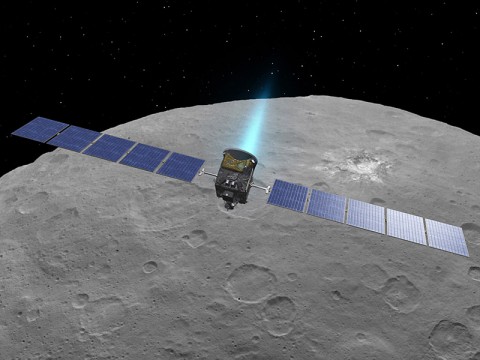 This artist concept shows NASA's Dawn spacecraft above dwarf planet Ceres, as seen in images from the mission. (NASA/JPL-Caltech/UCLA/MPS/DLR/IDA)