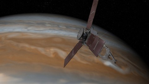 This artist's rendering shows NASA's Juno spacecraft making one of its close passes over Jupiter. (NASA/JPL-Caltech)