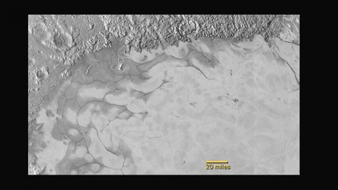 New Horizons discovers flowing ices in Pluto’s heart-shaped feature. In the northern region of Pluto’s Sputnik Planum (Sputnik Plain), swirl-shaped patterns of light and dark suggest that a surface layer of exotic ices has flowed around obstacles and into depressions, much like glaciers on Earth. (NASA/JHUAPL/SwRI)