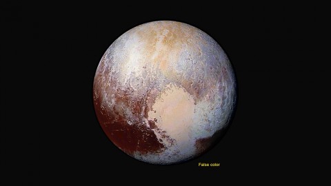 Four images from New Horizons’ Long Range Reconnaissance Imager (LORRI) were combined with color data from the Ralph instrument to create this enhanced color global view of Pluto. (The lower right edge of Pluto in this view currently lacks high-resolution color coverage.) The images, taken when the spacecraft was 280,000 miles (450,000 kilometers) away, show features as small as 1.4 miles (2.2 kilometers), twice the resolution of the single-image view taken on July 13. (NASA/JHUAPL/SwRI)