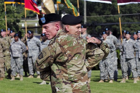 Maj. Gen. Gary J. Volesky, commanding general of the 101st Airborne Division (Air Assault) and Fort Campbell, Ky., welcomes Brig. Gen. John E. Novalis II, deputy commanding general for support of the 101st, during an Honor Eagle ceremony outside of the division headquarters building, Fort Campbell, Ky., Aug. 12, 2015. (Staff Sgt. Matthew W. Ard, 101st Airborne Division (Air Assault) Public Affairs)