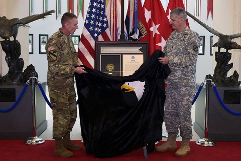 From right: Gen. David M. Rodriguez, commanding general, U.S. Africa Command, and Maj. Gen. Gary J. Volesky, commanding general, 101st Airborne Division (Air Assault) and Fort Campbell, unveil the Joint Meritorious Unit Award during a ceremony at McAuliffe Hall August 27, 2015. (Jerry Woller, Lead VI Specialist-Fort Campbell) From right: Gen. David M. Rodriguez, commanding general, U.S. Africa Command, and Maj. Gen. Gary J. Volesky, commanding general, 101st Airborne Division (Air Assault) and Fort Campbell, unveil the Joint Meritorious Unit Award during a ceremony at McAuliffe Hall August 27, 2015. (Jerry Woller, Lead VI Specialist-Fort Campbell)