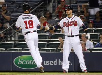Atlanta Braves shortstop Andrelton Simmons (19) is congratulated by first baseman Nick Swisher   (23) after scoring a run against the Colorado Rockies in the fifth inning at Turner Field. (Brett   Davis-USA TODAY Sports)