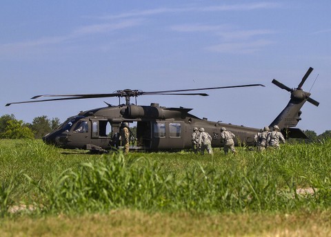 Soldiers with the 58th Signal Company, 101st Special Troops Battalion, 101st Airborne Division (Air Assault) Sustainment Brigade, practice loading casualties into a helicopter for a medical evacuation scenario during a field training exercise in the training area of Fort Campbell, Ky., Aug. 13, 2015.  (Sgt. 1st Class Mary Rose Mittlesteadt, 101st Airborne Division (Air Assault) Sustainment Brigade Public Affairs)