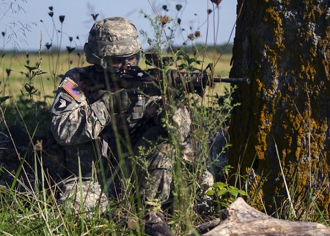 Spc. David Overman, communications specialist, 58th Signal Company, 101st Special Troops Battalion, 101st Airborne Division (Air Assault) Sustainment Brigade, provides security for a medical evacuation scenario during a field training exercise in the training area of Fort Campbell, Ky., Aug. 13, 2015. (Sgt. 1st Class Mary Rose Mittlesteadt, 101st Airborne Division (Air Assault) Sustainment Brigade Public Affairs)