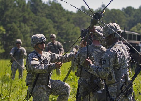 Spc. Timothy Cruz, communications specialist, 58th Signal Company, 101st Special Troops Battalion, 101st Airborne Division (Air Assault) Sustainment Brigade, sets up an antenna during a field training exercise in the training area of Fort Campbell, Ky., Aug. 12, 2015. (Sgt. 1st Class Mary Rose Mittlesteadt, 101st Airborne Division (Air Assault) Sustainment Brigade Public Affairs)