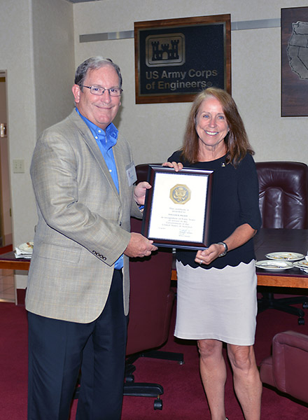 Jo-Ellen Darcy, assistant secretary of the Army for civil works, presents Mike Wilson, U.S. Army Corps of Engineers Nashville District Deputy District Engineer for Program Management, a certificate in recognition for 40 years of government service Aug. 11, 2015 onboard the Motor Vessel Mississippi during a stop in Clarksville, Tenn. (Mark Rankin, U.S. Army Corps of Engineers, Nashville District)