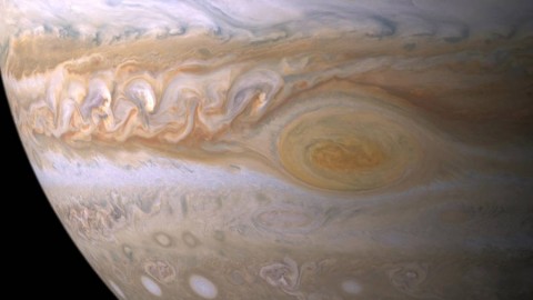 Trapped between two jet streams, the Great Red Spot is an anticyclone swirling around a center of high atmospheric pressure that makes it rotate in the opposite sense of hurricanes on Earth. (NASA)