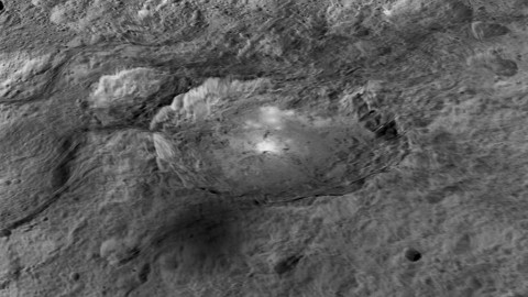 The intriguing brightest spots on Ceres lie in a crater named Occator, which is about 60 miles (90 kilometers) across and 2 miles (4 kilometers) deep. (NASA/JPL-Caltech/UCLA/MPS/DLR/IDA/LPI)