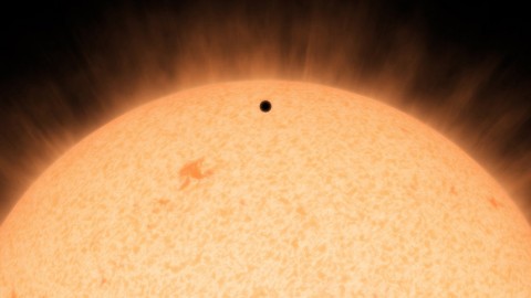 This artist's conception shows the silhouette of a rocky planet, dubbed HD 219134b, as it passes in front of its star. (NASA/JPL-Caltech)