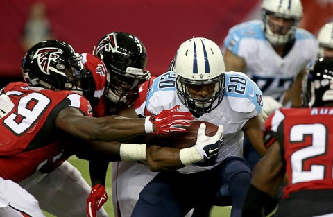 Tennessee Titans running back Bishop Sankey (20) gets tackled by Atlanta Falcons linebacker Joplo Bartu (59) and others in the first quarter of their preseason NFL football game at Georgia Dome. (Jason Getz-USA TODAY Sports)