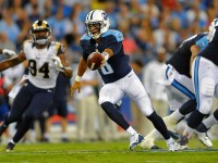 Tennessee Titans quarterback Marcus Mariota (8) fakes the hand off during the first half against the St. Louis Rams at Nissan   Stadium. (Christopher Hanewinckel-USA TODAY Sports)