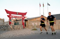 The 3rd BCT, 101st Airborne Division Soldiers run past the Operational Base Fenty entrance in eastern Afghanistan during the Train, Advise, Assist, Command-East Soldier and Noncommissioned Officer of the Year competition, Aug. 5, 2015. (Capt. Charles Emmons, 3rd Brigade Combat Team, 101st Airborne Division (AA) Public Affairs)