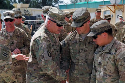 Gen. John F. Campbell, commander of Resolute Support and U.S. Forces Afghanistan, shakes hands with 3rd BCT, 101st Airborne Division Soldiers present for the dedication of a medical clinic named for their fallen platoon medic, Sept. 17th, 2015, in eastern Afghanistan. The Corporal John M. Dawson Medical Clinic was dedicated to a 3rd BCT, 101st Airborne Division medic who was killed in an insider attack April 8th, 2015, in Nangarhar province. (Capt. Charles Emmons, 3rd Brigade Combat Team, 101st Airborne Division (AA) Public Affairs)