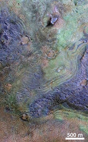 This view combines information from two instruments on a NASA Mars orbiter to map color-coded composition over the shape of the ground within the Nili Fossae plains region of Mars. (NASA/JPL-Caltech/JHUAPL/Univ. of Arizona)